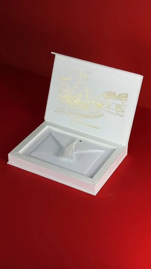 box, envelope and wedding invitation with gold embossing